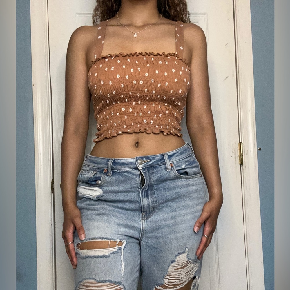 Brown, ribbed/ruffled crop tank top. Mini flower pattern.